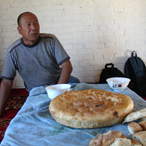 Uigur man with bread